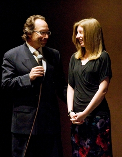 Origins_Essay_Contest_Winner_CROPPED On stage at ASU’s Gammage auditorium, engineering honors student Jessica Piper (right) accepts congratulations for winning the ASU Origins Project Science and Culture Essay Competition from ASU Origins Project director Lawrence Krauss. Photo: Tom Story/ASU