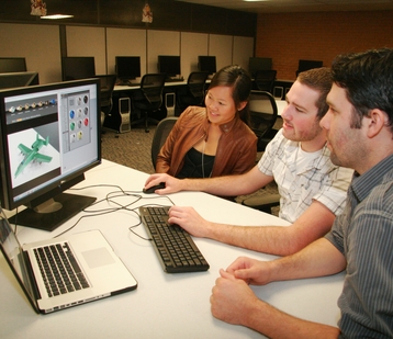 High_Performance_Computing_Lab_G-150_A_Cropped Checking out a computer-aided design software program at the new High Performance Computing Lab are (from left) Amanda Dong, a student who works with the student outreach retention program for the Ira A. Fulton Schools of Engineering, and Nick Becker and Wes Roberts, who work for Engineering Technical Services. Photo: Blaine Coury/ASU