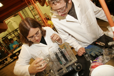 Chemical engineering students Alison Davis (left) and Andrew Chesley perform labs tests in preparation for the national Chem-E-Car competition. Photo: Blaine Coury/ASU