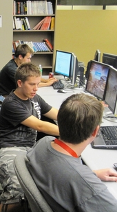 The Software Developer’s Association student club enables ASU students (from top) students Joe Cowen-Richards, David Kahn and Patrick Traynor to work with some of the latest computer software programs. Photo: Travis Sein/ASU