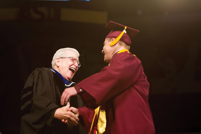 Ira A. Fulton greets students at convocation.