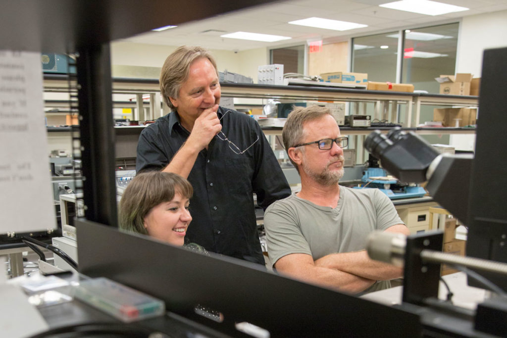 Assistant Professor Hugh Barnaby (right) and Professor Michael Kozicki (center) apply their expertise in radiation effects and memory to test next-generation neuromorphic computing architectures for use in critical applications where radiation is a likely concern. 