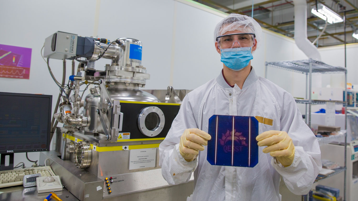 Chemical engineering recent graduate Lyle Bliss poses in the QESST Lab.