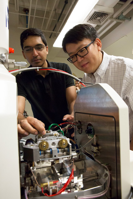 Photo of Yongming Liu and Fraaz Tahir working in a lab with a caption of "Professor Yongming Liu (right) pictured with Fraaz Tahir, a mechanical engineering doctoral student. Liu is leading a $10 million project funded by NASA to make next-generation aviation safer and more efficient. Photographer: Pete Zrioka/ASU"