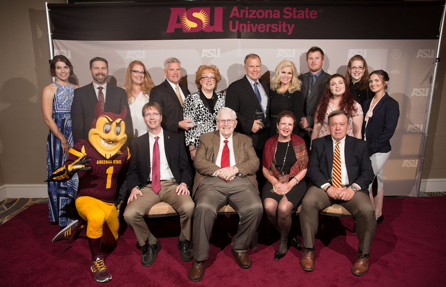 Photo of the Fulton family standing and sitting for a posed portrait. Caption: The Fulton Family was honored as the 2018 Founder’s Day Philanthropists of the Year for their vision, leadership and commitment to advance Arizona State University and the New American University. Photographer: Timon Harper