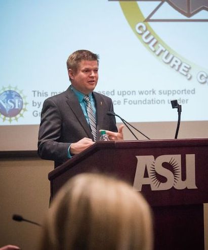 Man speaking at a podium