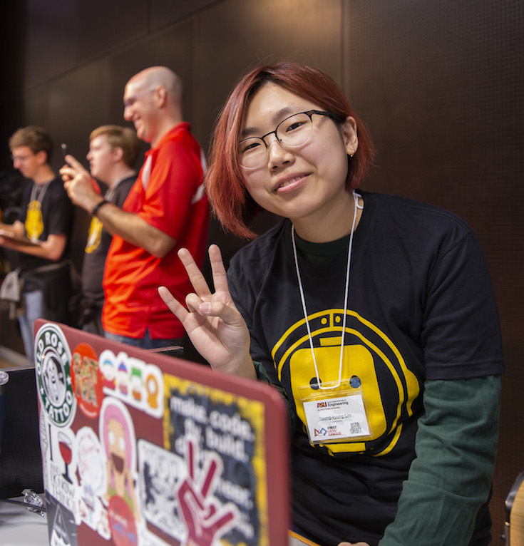 female student sitting behind a laptop