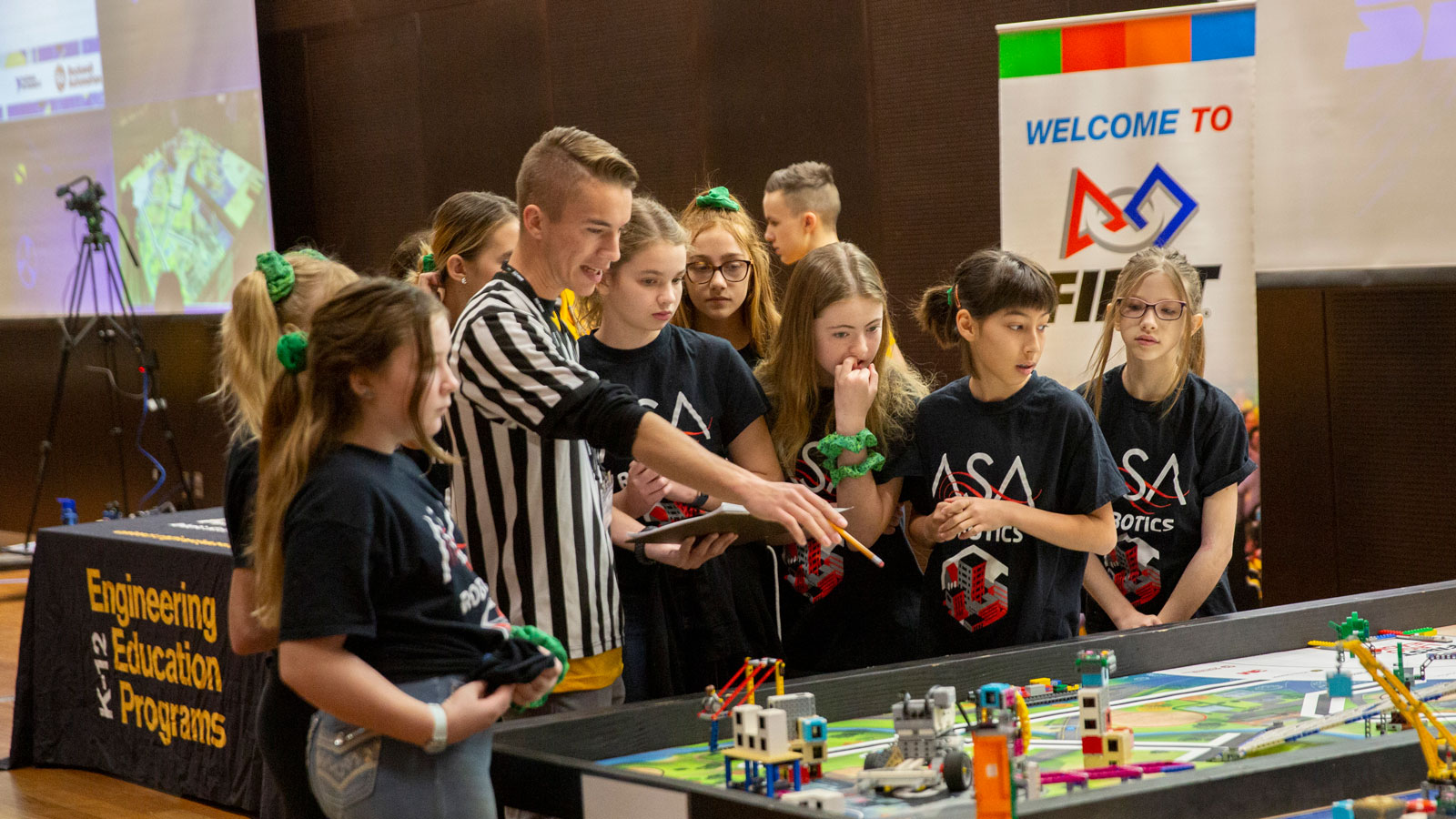 group of girls with a referee at a competition