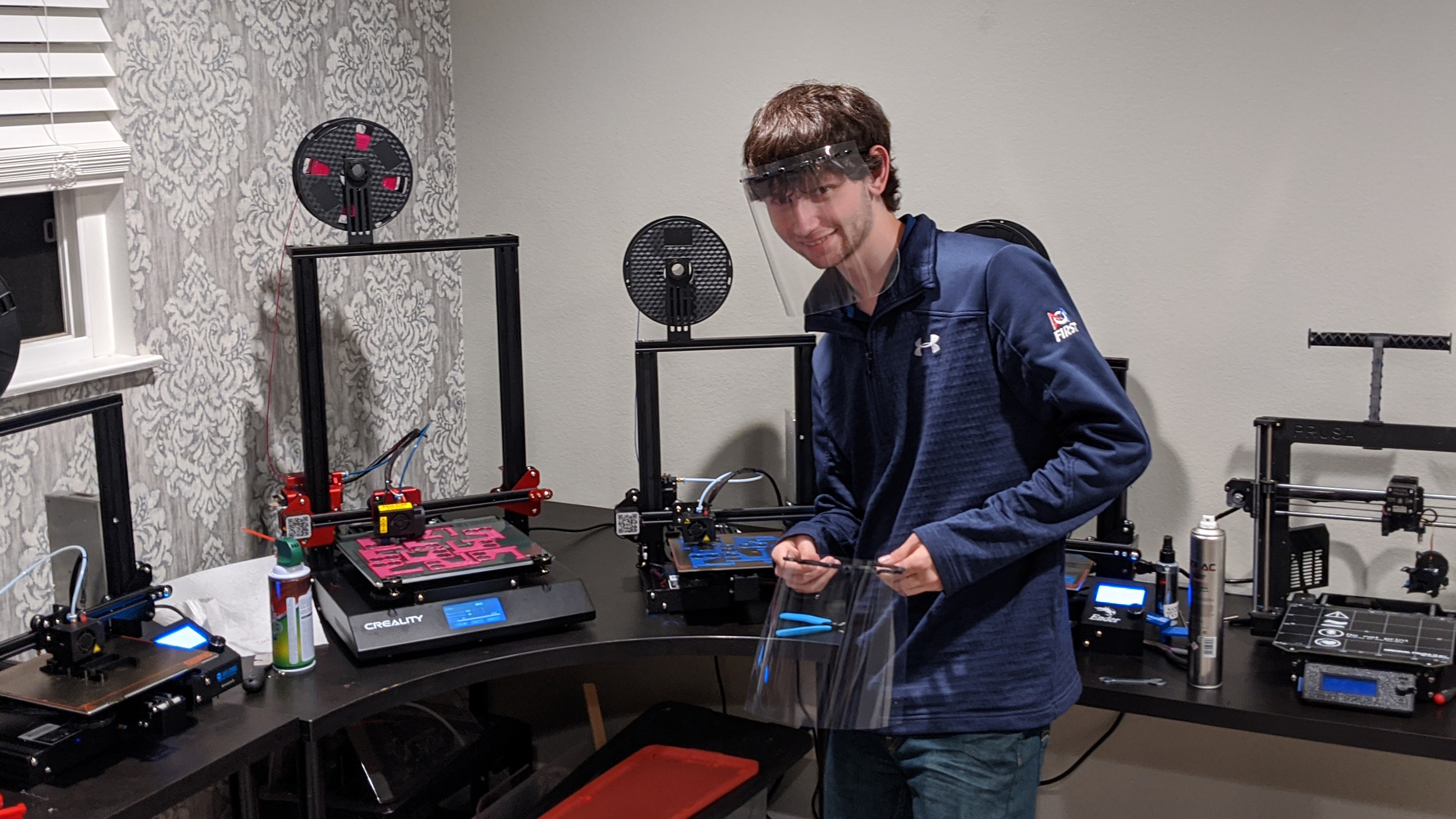 Aaron Dolgin in front of 3D printers