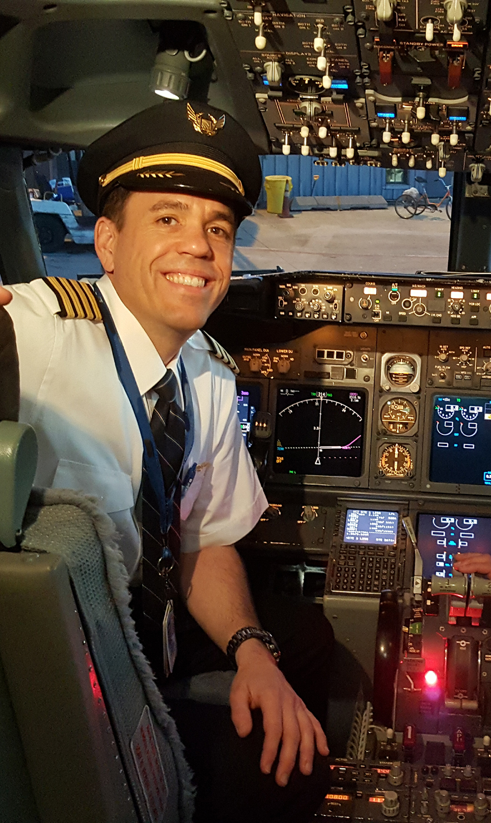 Greg Sumner, an airline captain, sits in the flight deck of a Boeing 737 aircraft.