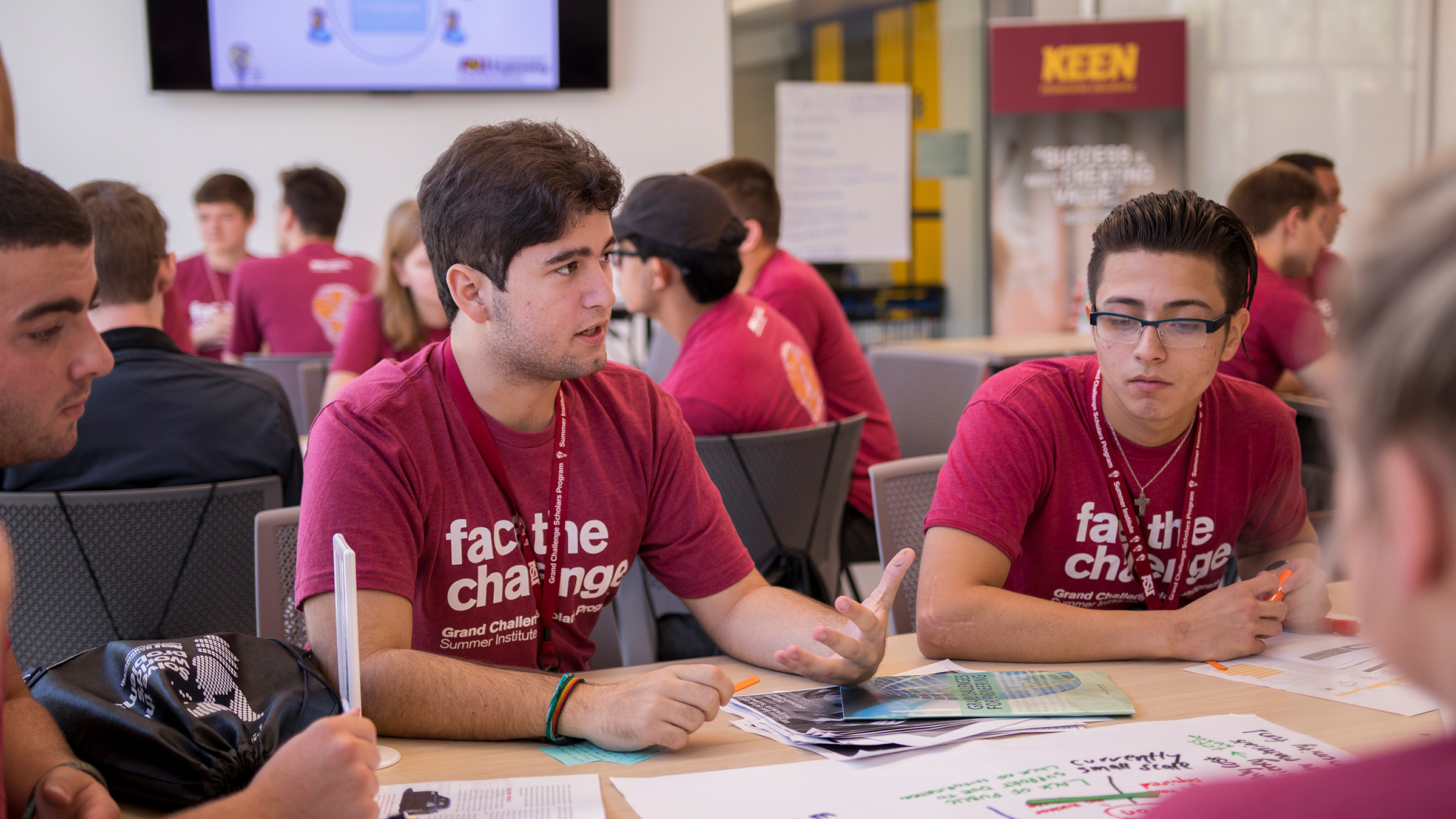 Group of GCSP students sitting at a table in 2017