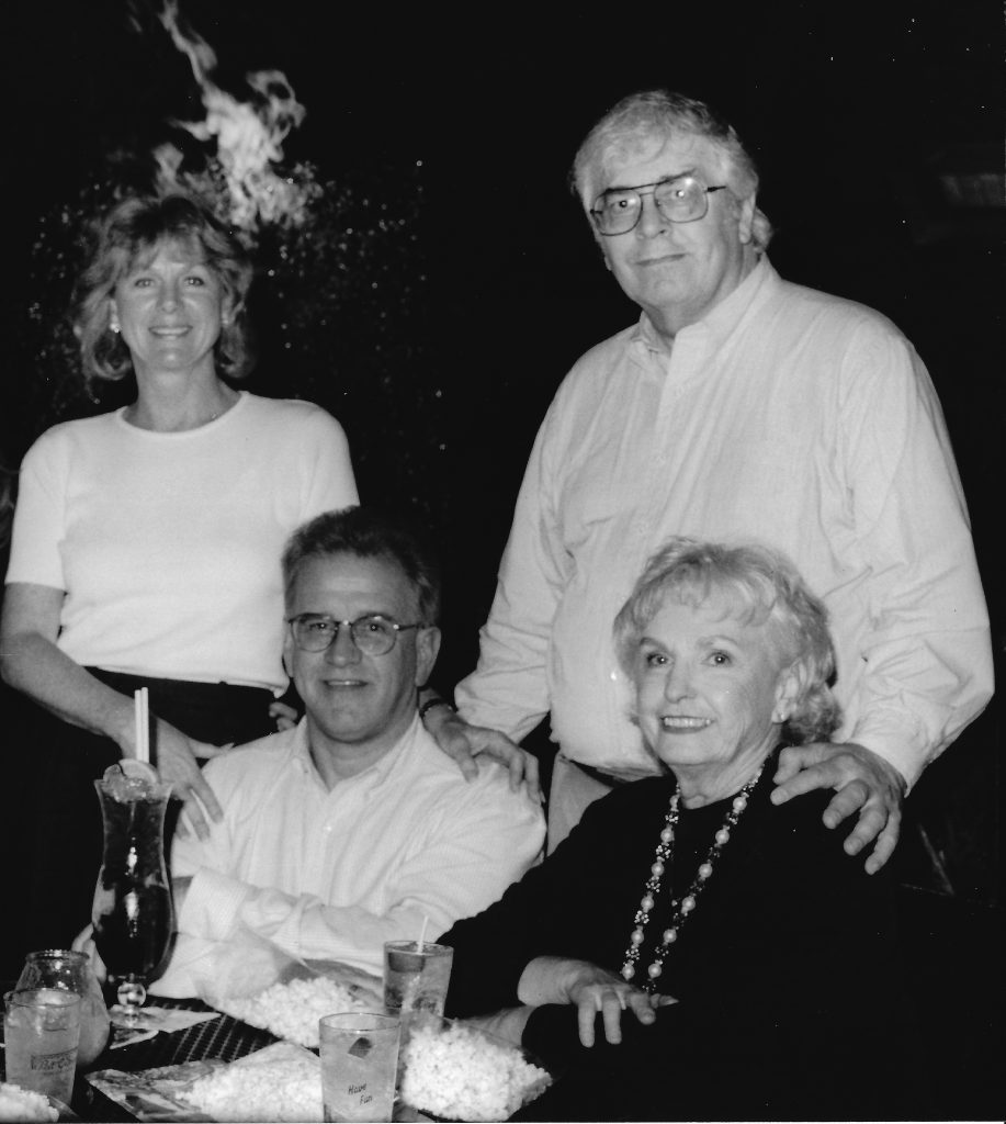 black and white photo of four people