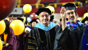 Emeritus Professor Thomas Schildgen, shown at the far left in a processional at a Fulton Schools convocation ceremony, has launched a scholarship to support incoming transfer students and continuing students in the graphic information technology program at the Ira A. Fulton Schools of Engineering. Photographer: Hayden Taylor/ASU