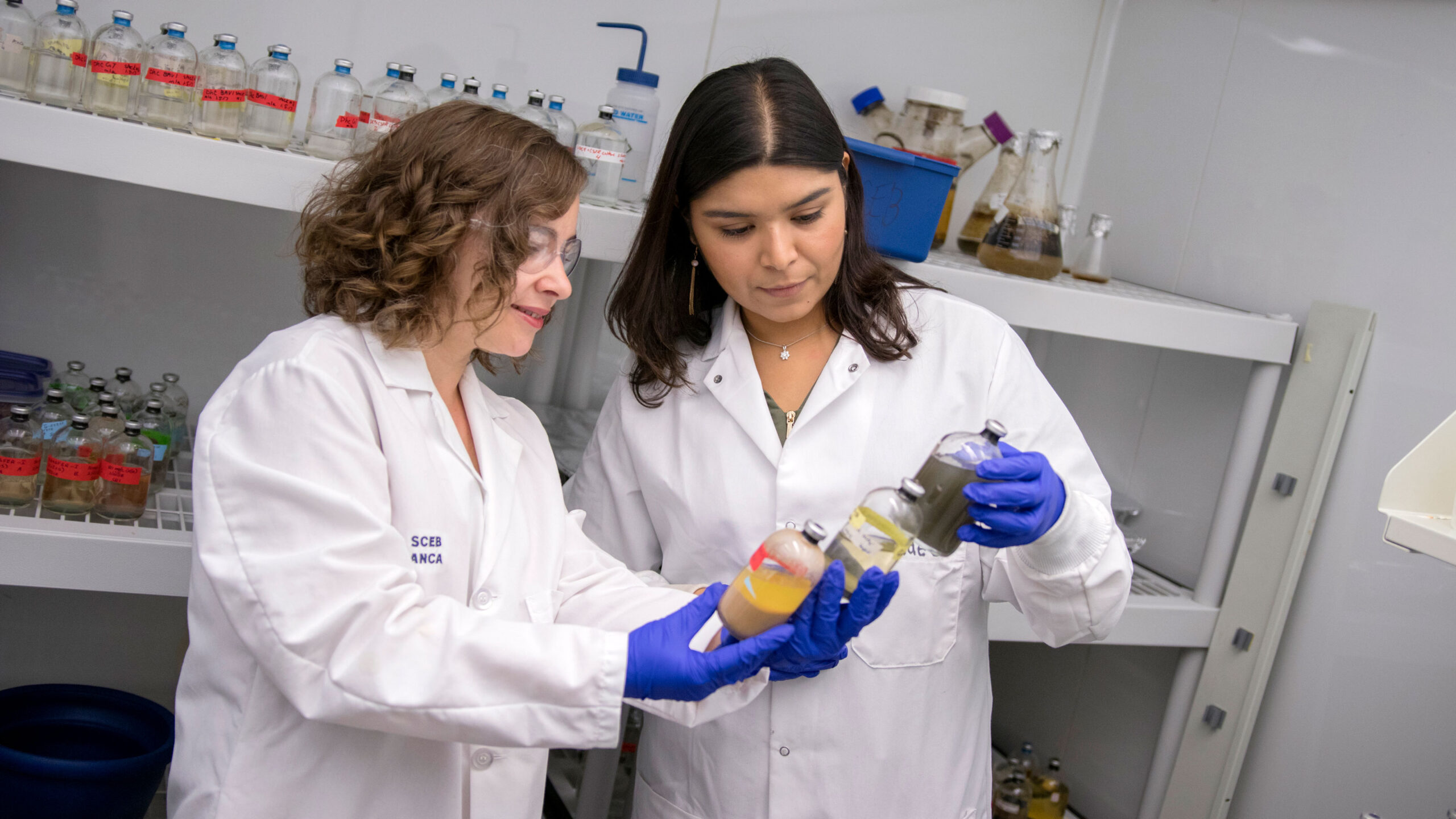 Anca Delgado and Aide Robles in a lab