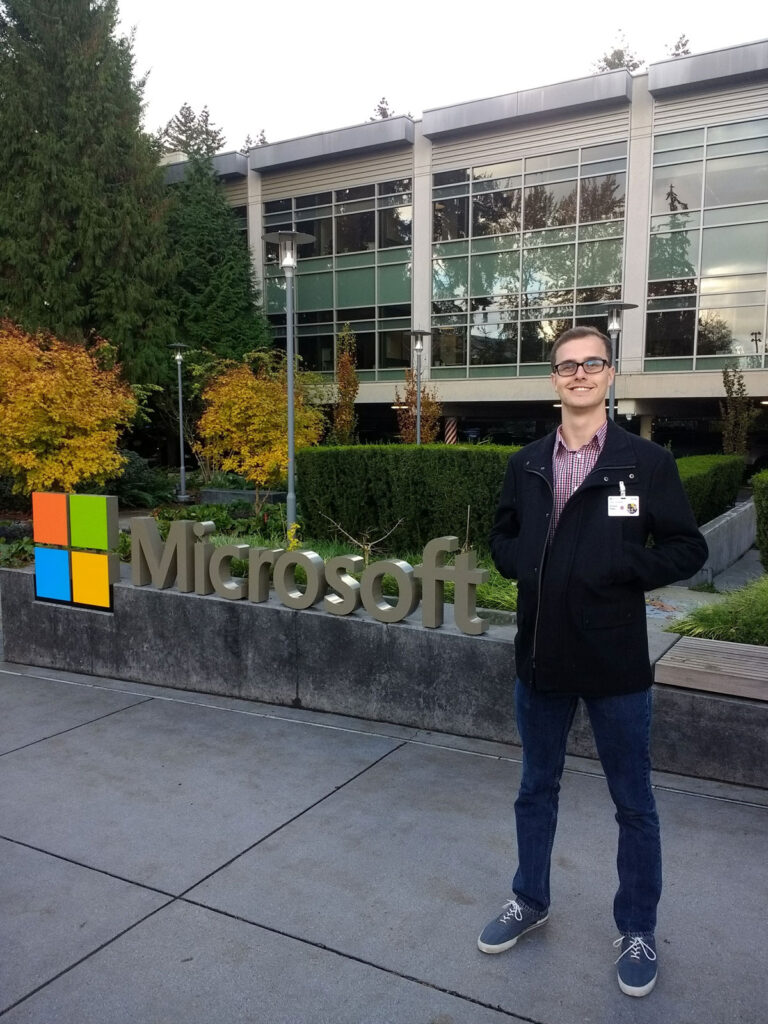 Ira A. Fulton Schools of Engineering electrical engineering alumnus Richard Rigby poses in front of a Microsoft sign in Redmond, Washington.