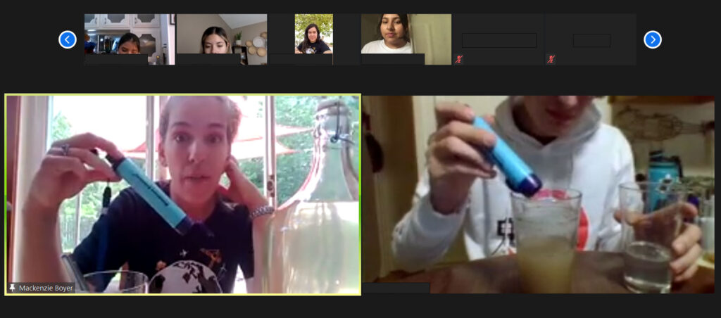 A Zoom screenshot in which Lecturer Mackenzie Boyer and a SEE@ASU participant are holding water filtration devices next to a container of dirty water.