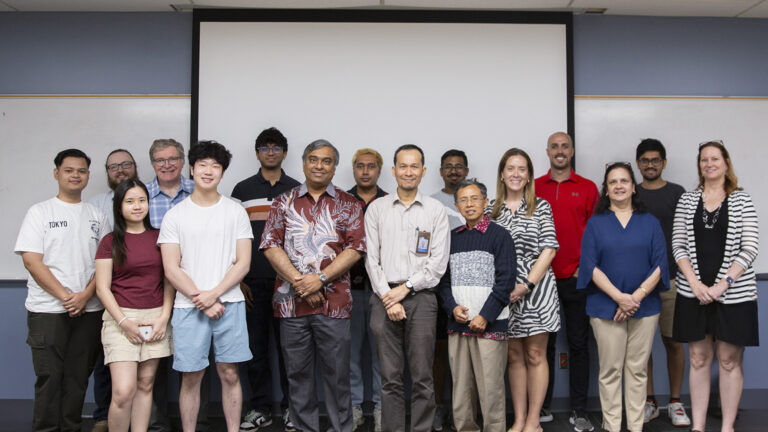 Astria Nur Irfansyah (center) and Totok Mujiono (first right from center), both engineering faculty from the Institut Teknologi Sepuluh Nopember, pose for a photo with Fulton Professor of Microelectronics Krishnendu Chakrabarty (first left from center), staff and students.