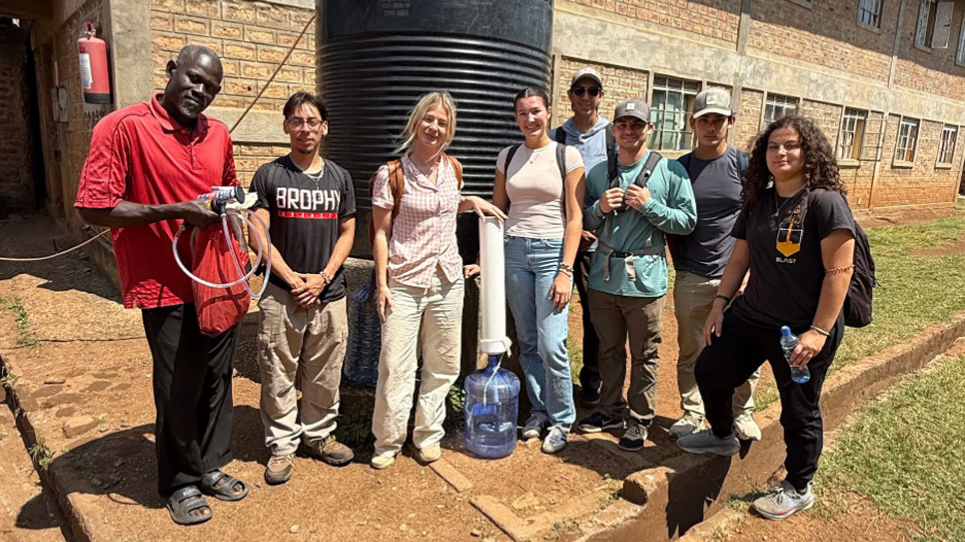 Arizona State University students with a scalable water filtration system in Naki, Kenya.