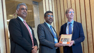 Kyle Squires poses with Amit Sharma and S. Krishnan