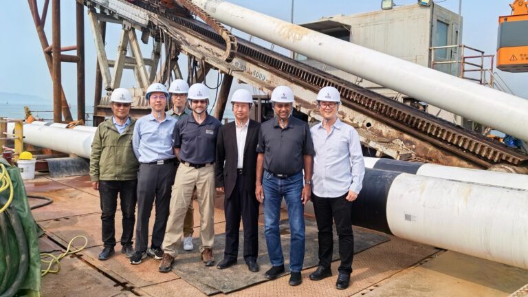 Jim Geisbush and Samuel Ariaratnam stand with the team from Sun Yat-sen University