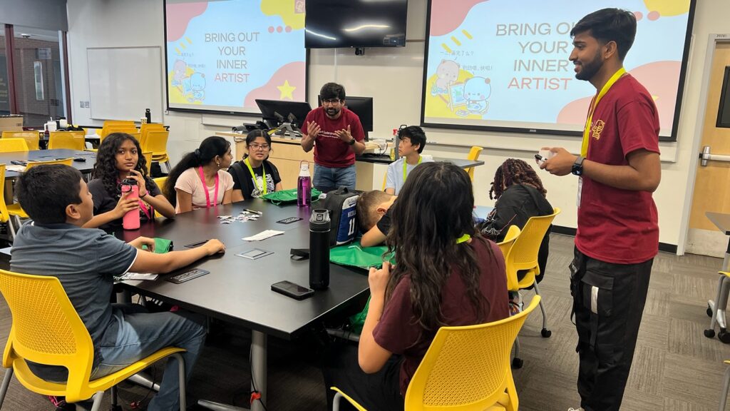 Adil Ahmad speaks with middle grade students at the 2025 Desert CodeSprouts